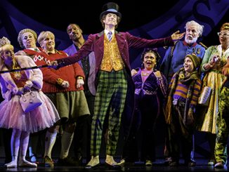Paul Slade Smith as Willy Wonka and the Cast of Charlie and the Chocolate Factory