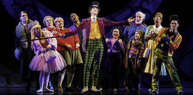 Paul Slade Smith as Willy Wonka and the Cast of Charlie and the Chocolate Factory