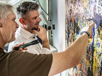 National-Gallery-of-Australia’s-Director-Nick-Mitzevich-and-Senior-Conservator-of-Paintings,-David-Wise-analysing-Jackson-Pollock’s-Blue-poles-1952