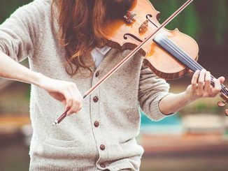 Violinist-playing-outdoors-photo-by-Clem-Onojeghuo-on-Unsplash