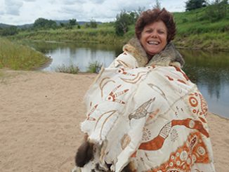 SLQ Art of the Skins Melinda Serico wearing the Gubbi Gubbi Kabi Kabi Cloak at Kenilworth, Queensland, 2016 - photo by Carol McGregor