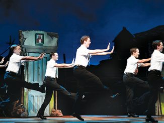 The Book of Mormon Rowan Witt as Elder McKinley and company - photo by Jeff Busby