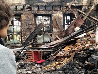 Caitlin Dullard and Liz Jones survey the aftermath of the fire at La Mama