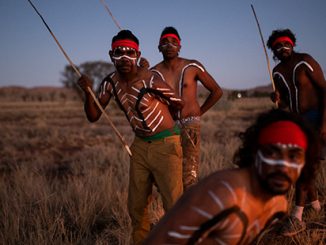 Jacob-Tiger-Kamarin-Mitakiki-Cameron-Young-and-Junior-Mitakiki-performing-inma-outside-Amata-Community-APY-Lands-SA-photo-by-Rohan-Thomson