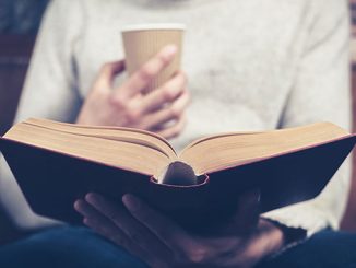 TC-Coffee-in-hand-book-in-lap